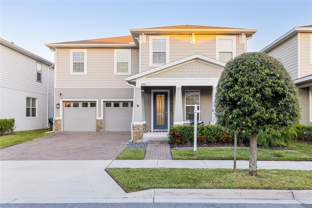 a view of a house with a yard and plants