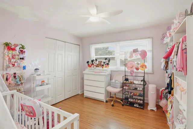 a bedroom with furniture and a window