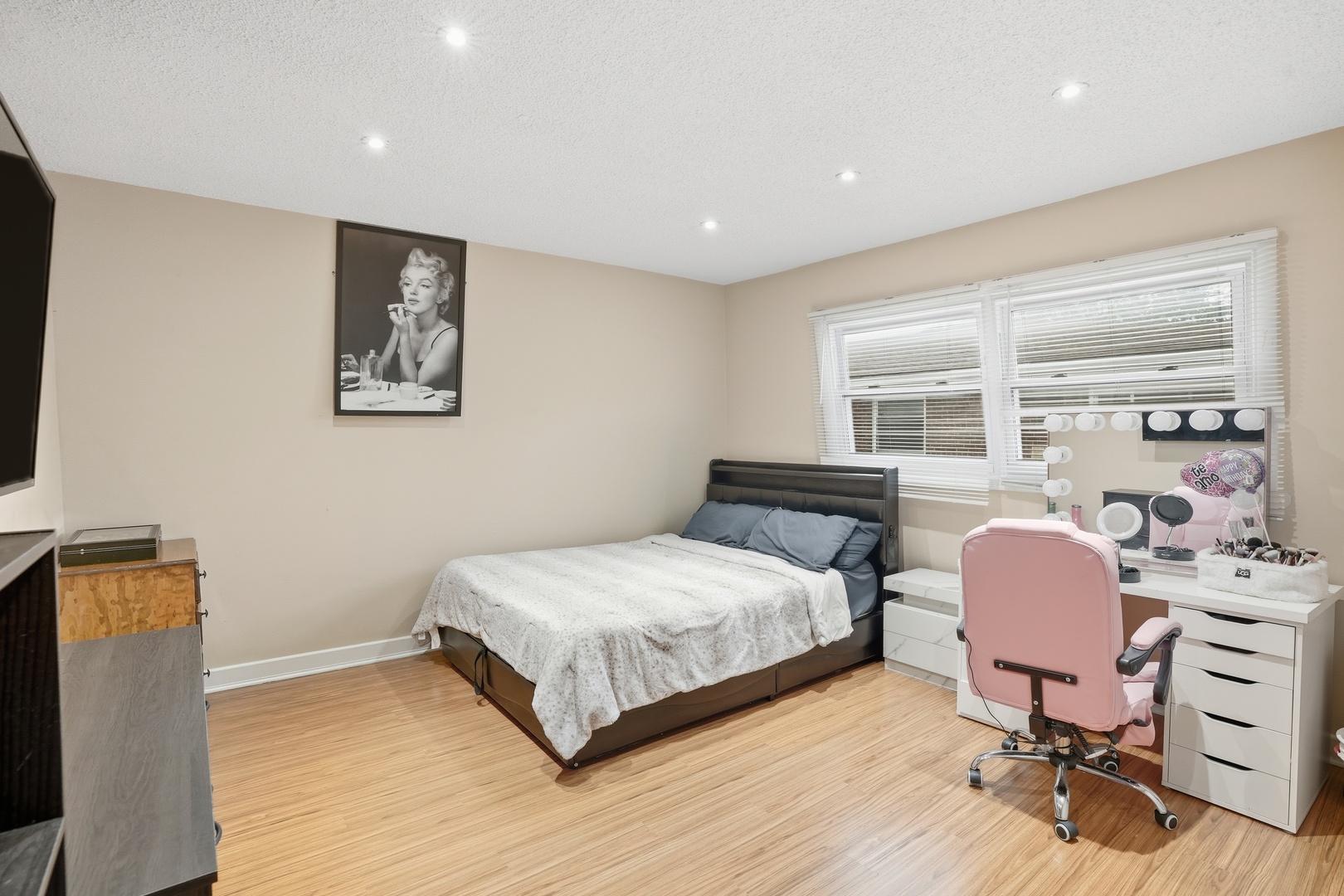 9708 Nottingham Avenue, Unit 9 Chicago Ridge, IL 60415 - Photo 13 of 26 a bedroom with a bed a chair and a large window