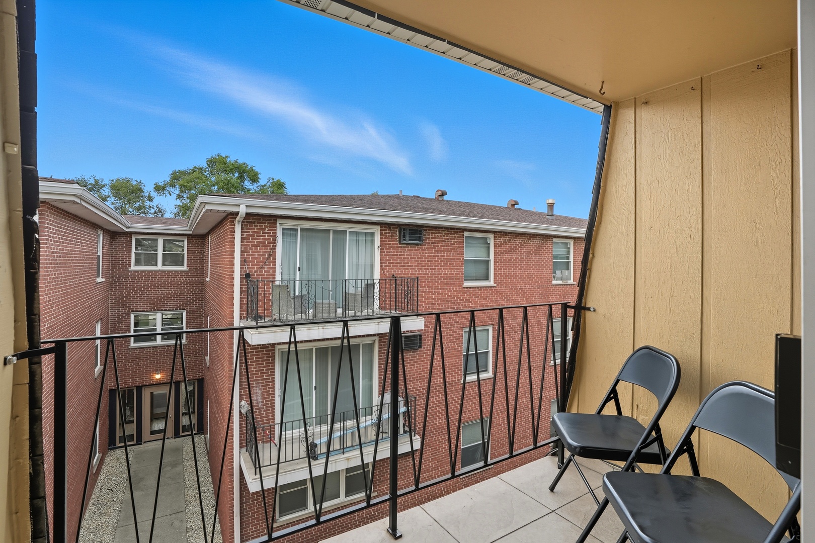 9708 Nottingham Avenue, Unit 9 Chicago Ridge, IL 60415 - Photo 18 of 26 a view of a chair and table in the balcony