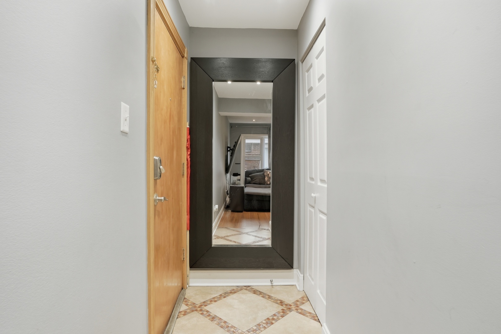 9708 Nottingham Avenue, Unit 9 Chicago Ridge, IL 60415 - Photo 20 of 26 a view of a hallway with a glass door and a window