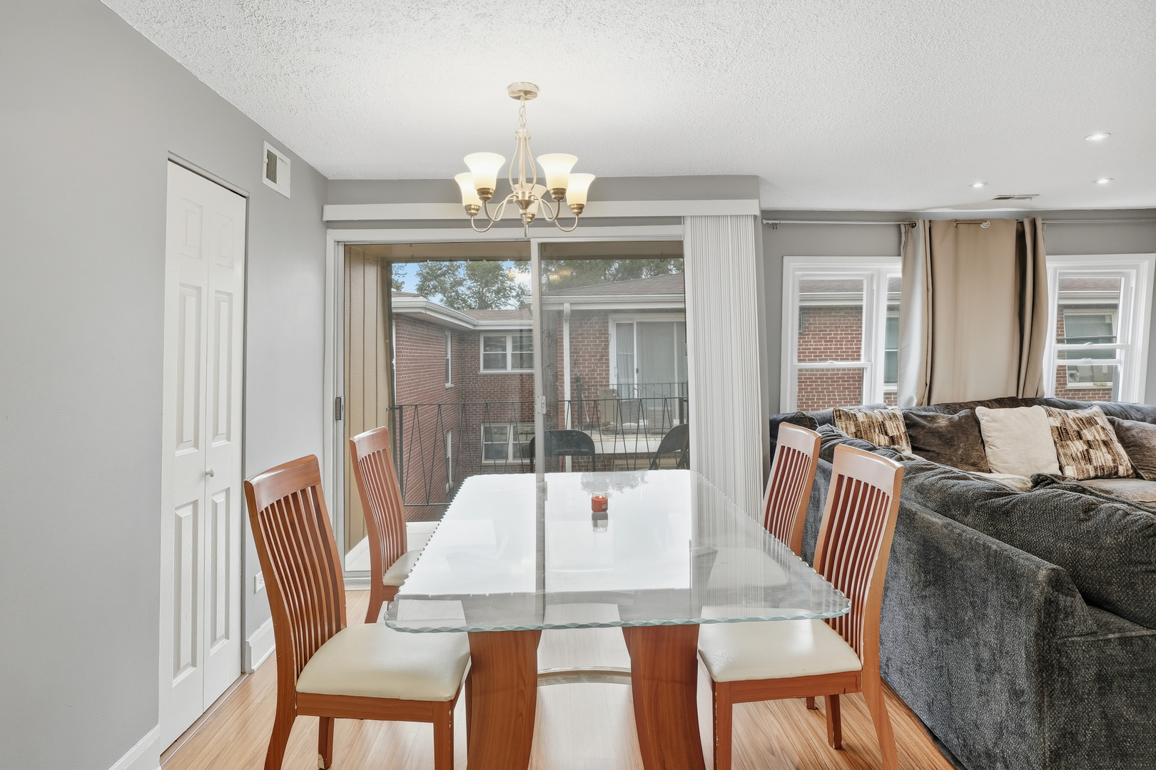 9708 Nottingham Avenue, Unit 9 Chicago Ridge, IL 60415 - Photo 5 of 26 a view of a dining room with furniture a chandelier and wooden floor