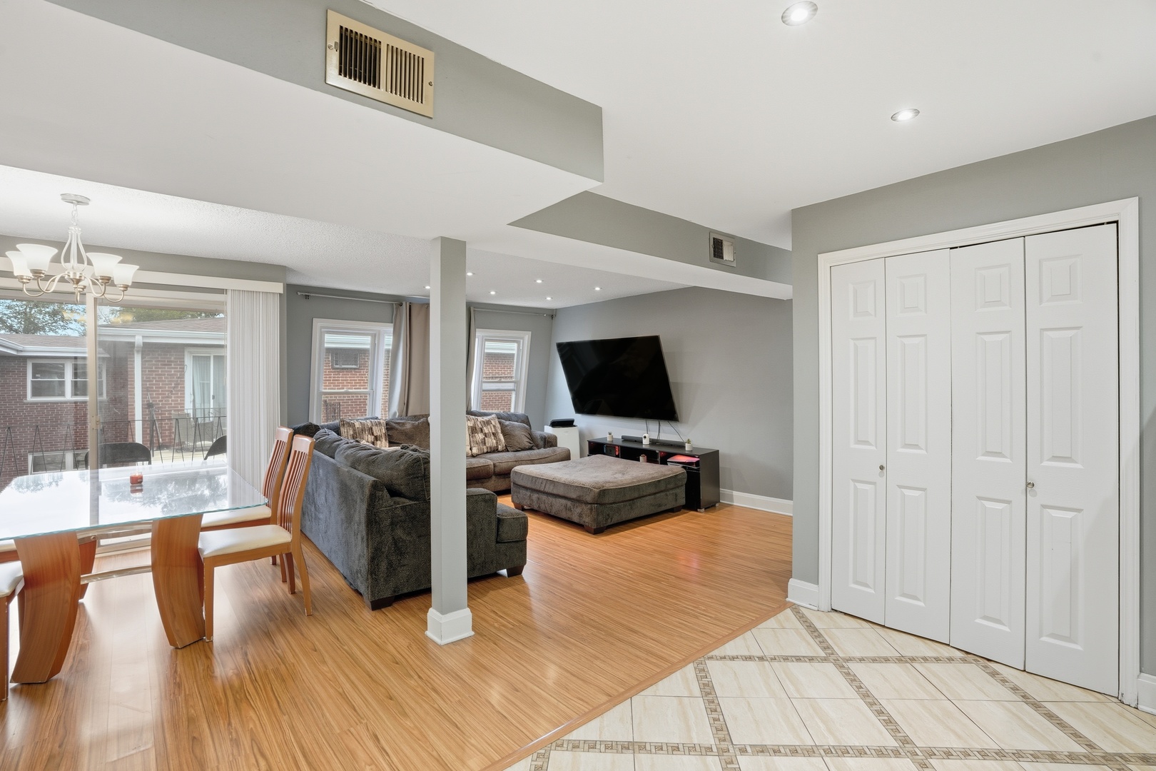 9708 Nottingham Avenue, Unit 9 Chicago Ridge, IL 60415 - Photo 9 of 26 a living room with furniture and a flat screen tv