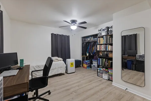 a view of a workspace with furniture and bathroom