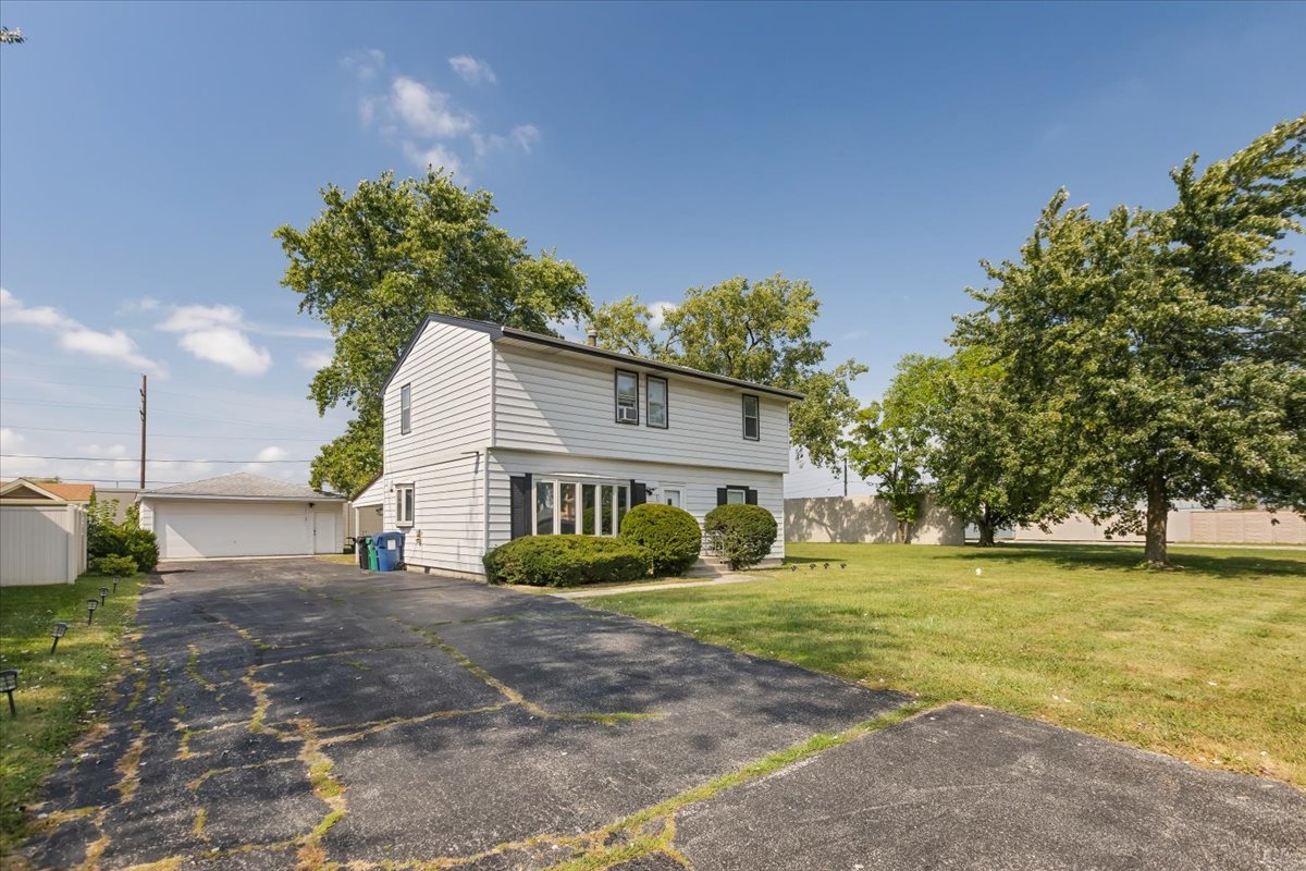 7506 Ferdinand Avenue Bridgeview, IL 60455 - Photo 2 of 32 a house view with a outdoor space