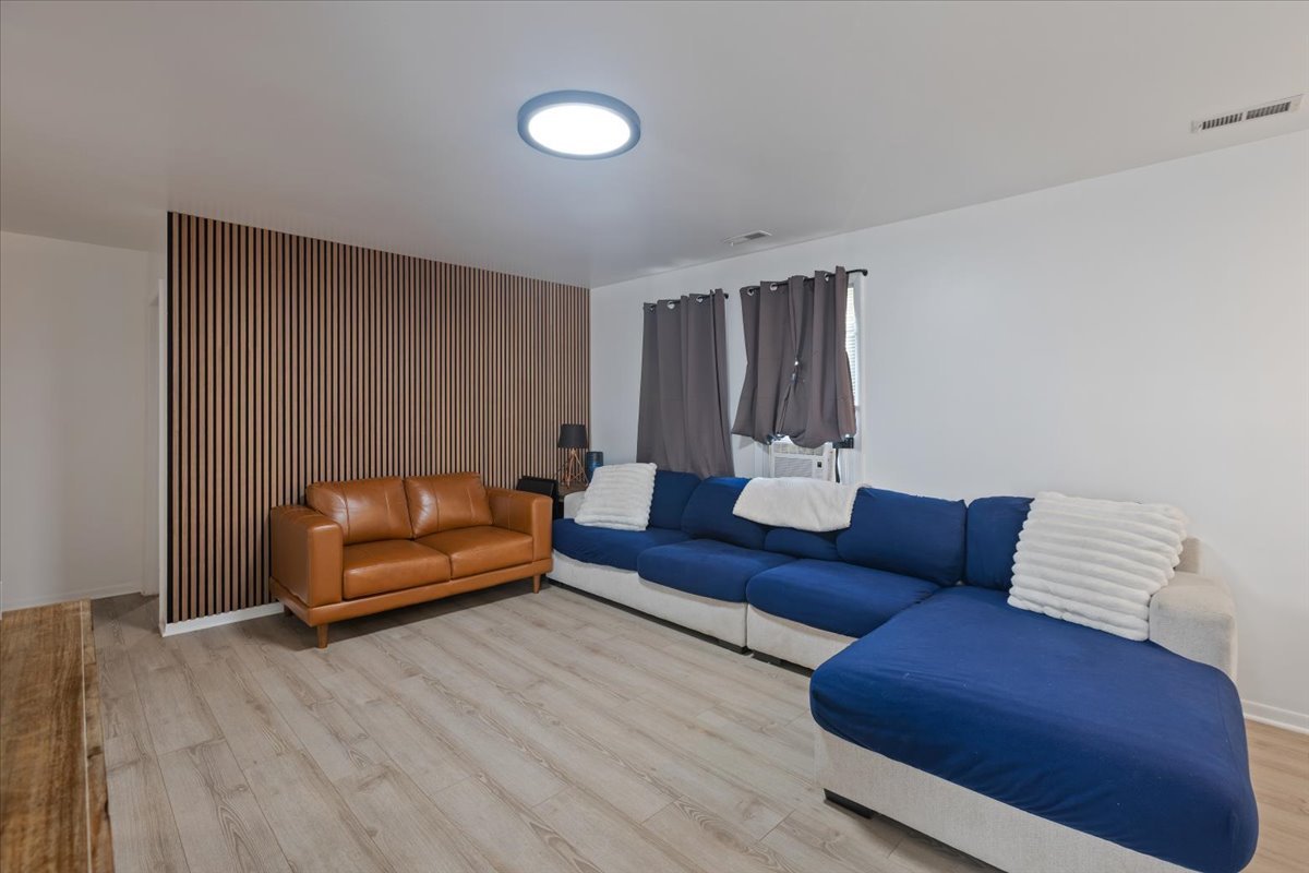 7506 Ferdinand Avenue Bridgeview, IL 60455 - Photo 21 of 32 a living room with furniture and wooden floor