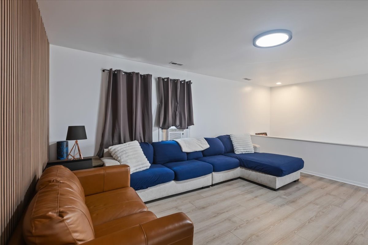 7506 Ferdinand Avenue Bridgeview, IL 60455 - Photo 22 of 32 a living room with furniture and a lamp