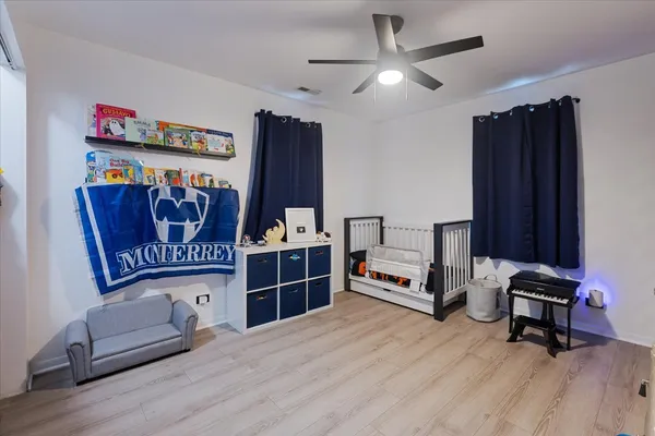 a bedroom with furniture and a window