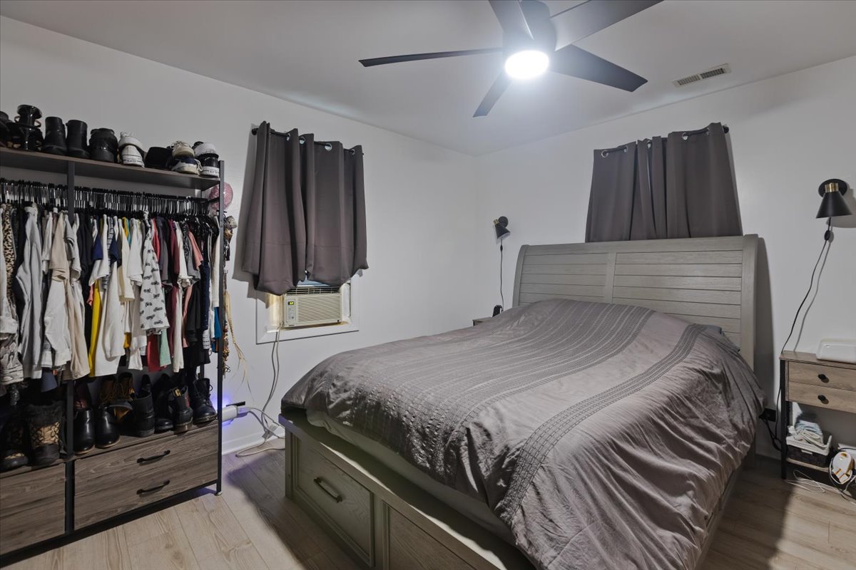 7506 Ferdinand Avenue Bridgeview, IL 60455 - Photo 28 of 32 a bedroom with a bed and a mirror