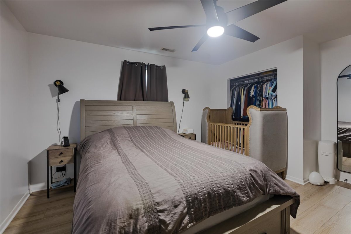 7506 Ferdinand Avenue Bridgeview, IL 60455 - Photo 29 of 32 a bedroom with a bed and a mirror