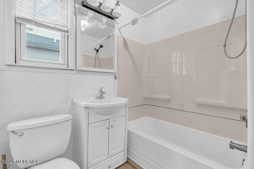 737 20th Avenue Lake Como, NJ 07719 - Photo 11 of 29 a bathroom with a sink a toilet and a bathtub