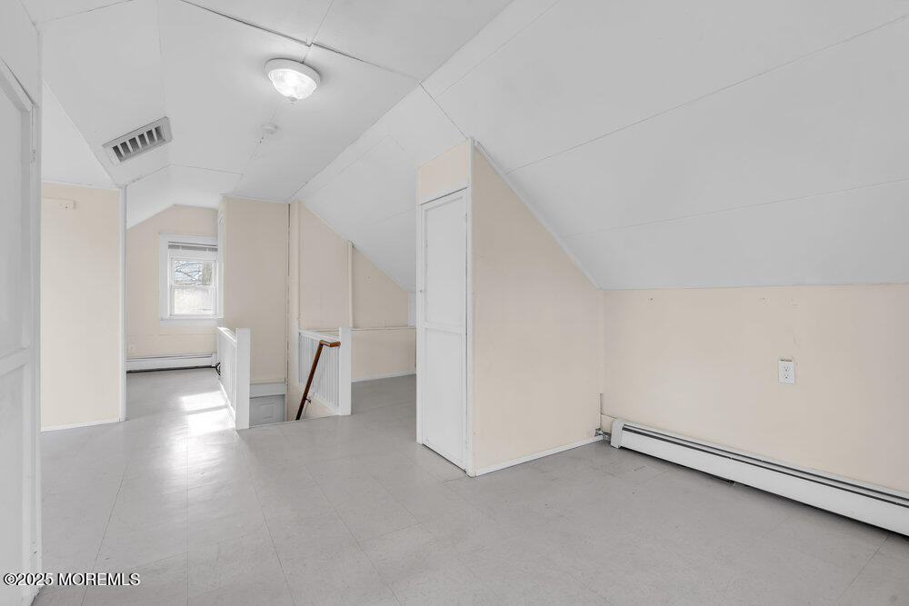 737 20th Avenue Lake Como, NJ 07719 - Photo 13 of 29 wooden floor in an empty room with a window
