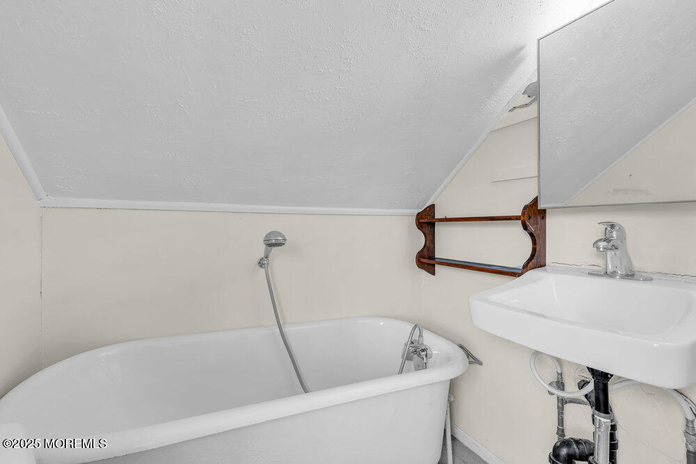737 20th Avenue Lake Como, NJ 07719 - Photo 14 of 29 a bathroom with a bathtub