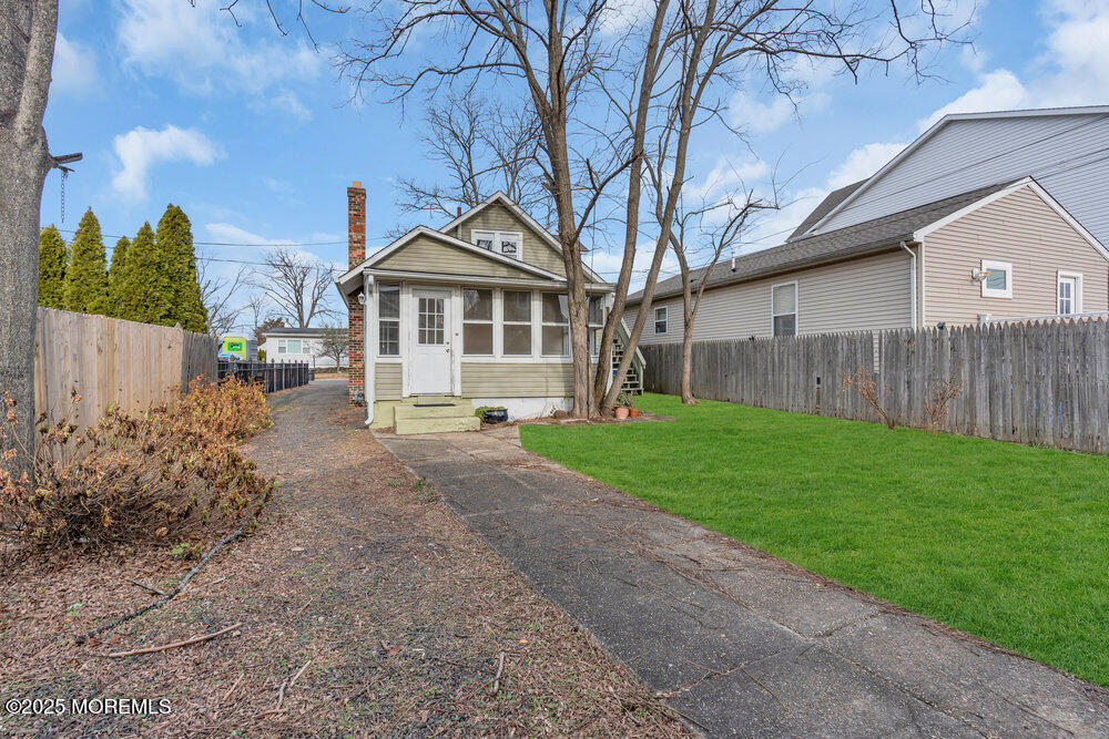 737 20th Avenue Lake Como, NJ 07719 - Photo 17 of 29 a front view of a house with garden
