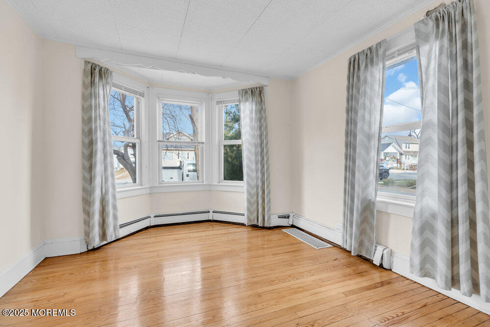 737 20th Avenue Lake Como, NJ 07719 - Photo 6 of 29 a view of empty room with wooden floor and fan