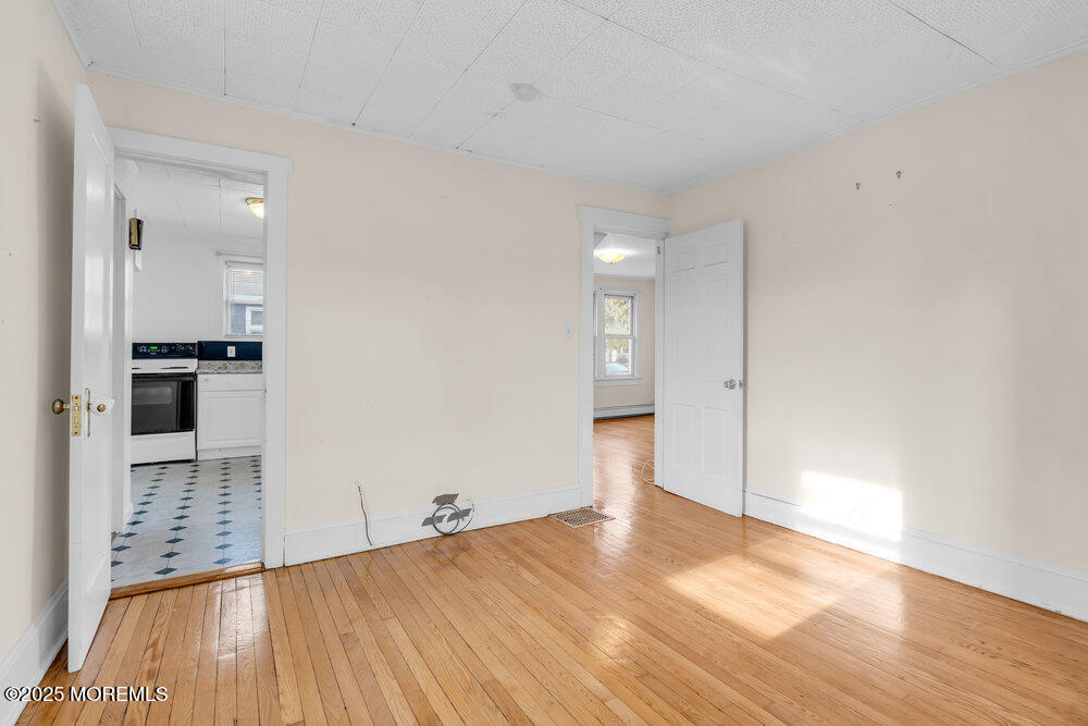 737 20th Avenue Lake Como, NJ 07719 - Photo 9 of 29 a view of empty room with wooden floor
