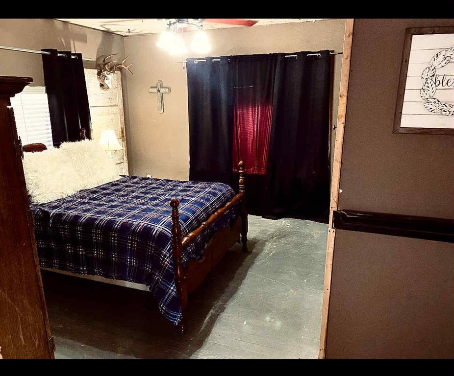 8108 Fm2111 Winters, TX 79567 - Photo 20 of 39 a bedroom with a bed and a mirror