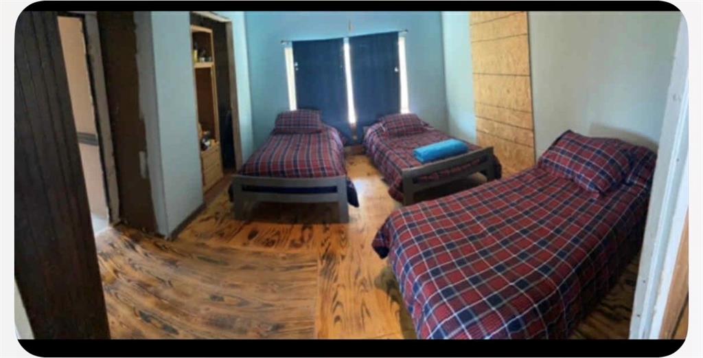 8108 Fm2111 Winters, TX 79567 - Photo 35 of 39 a bedroom with two beds and large windows