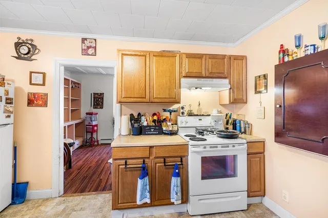 a kitchen with stainless steel appliances granite countertop a stove and a refrigerator
