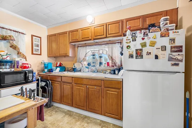 a kitchen with stainless steel appliances granite countertop a refrigerator and sink