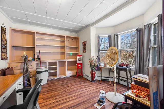 a room with furniture a rug and a window