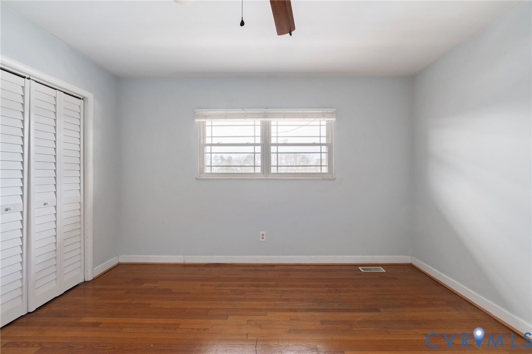 3109 North Parham Road, Unit 17 Henrico, VA 23294 - Photo 20 of 22 Unfurnished bedroom with a closet, dark wood finis