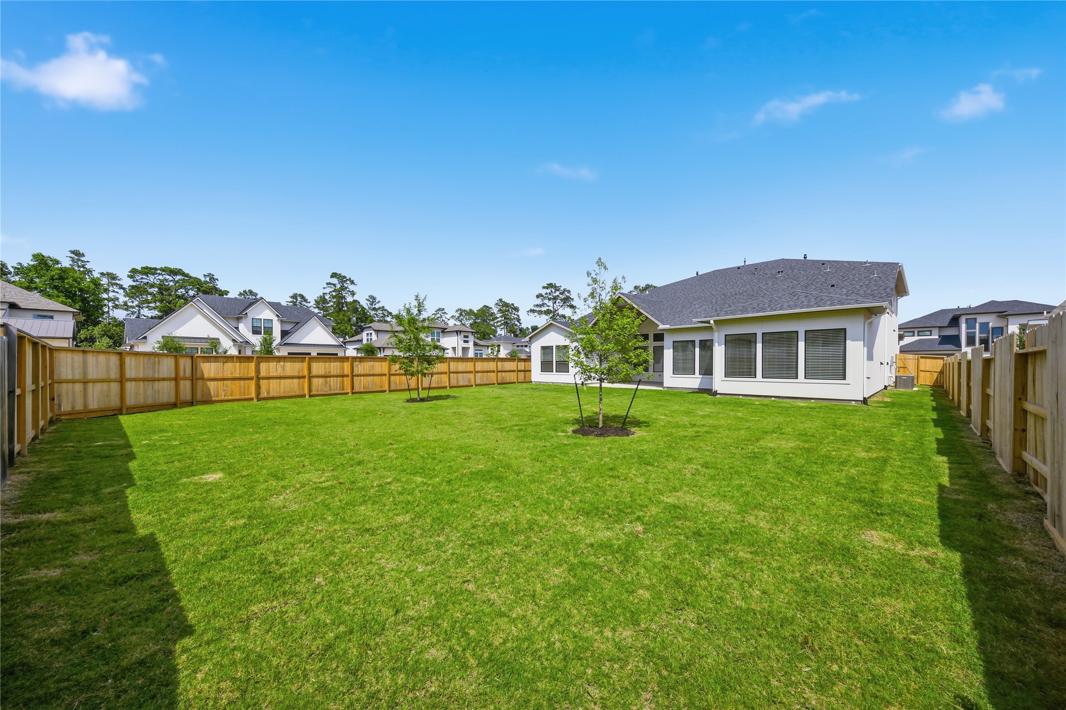 416 Venado View Court Conroe, TX 77304 - Photo 29 of 34 Oversized backyard with endless potential for a future pool, outdoor kitchen, or custom entertaining space - offering privacy, green space, and room to create your dream outdoor retreat.
