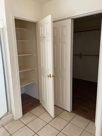 a view of an empty walk in closet