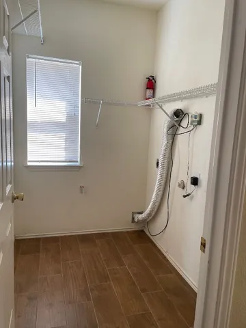 a bathroom with a shower and a window