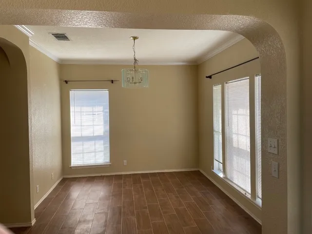 an empty room that has a window in it