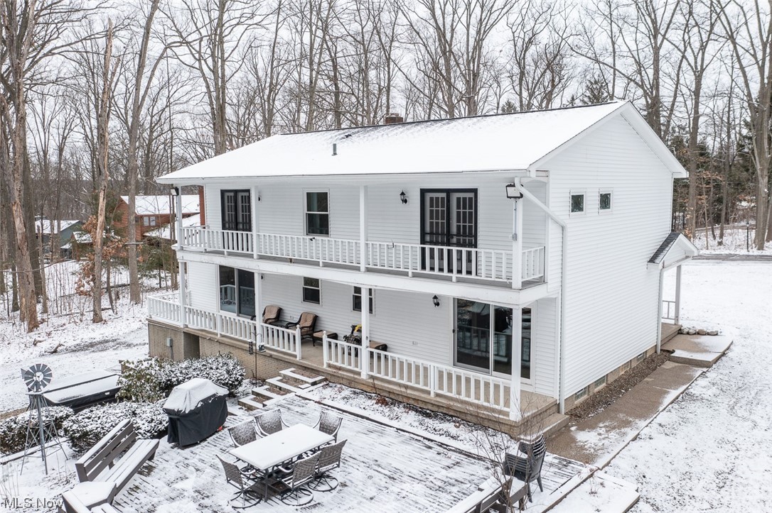 682 Center Road Hinckley, OH 44233 - Photo 2 of 43 Back covered porches off both levels of this house.