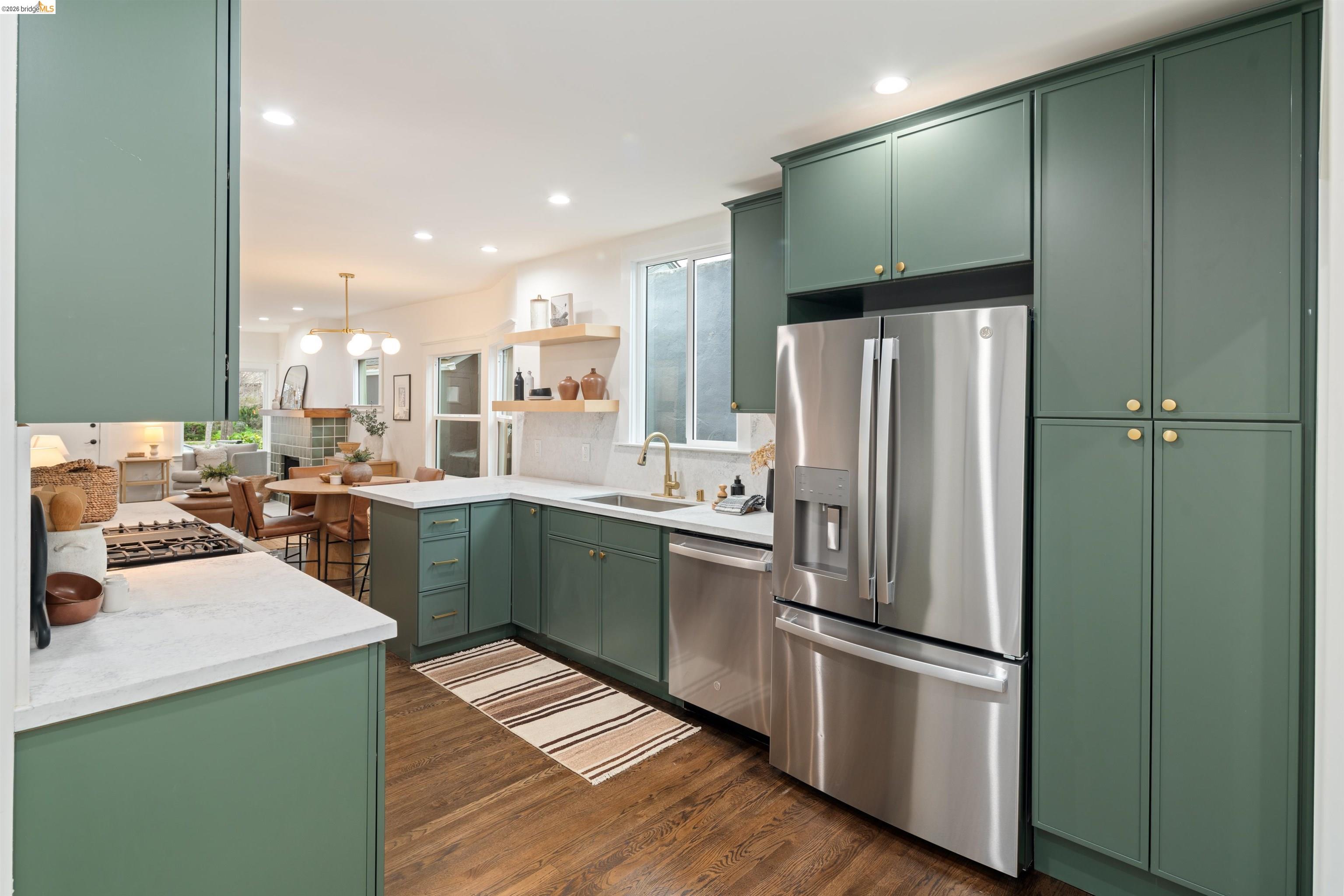 820 Key Rte Boulevard Albany, CA 94706 - Photo 11 of 48 a kitchen with stainless steel appliances a refrigerator and a sink