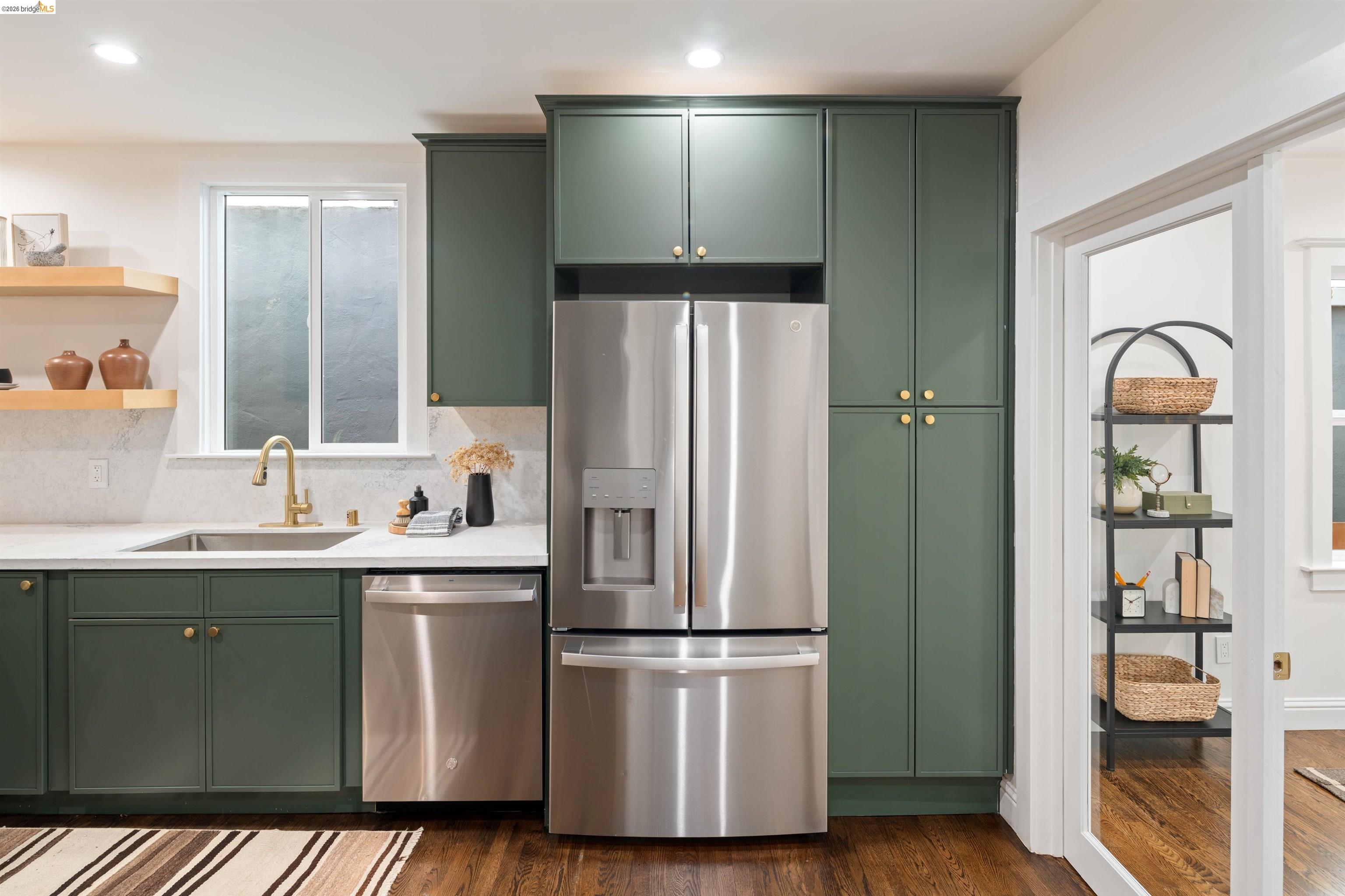 820 Key Rte Boulevard Albany, CA 94706 - Photo 12 of 48 a kitchen with stainless steel appliances a refrigerator and a sink