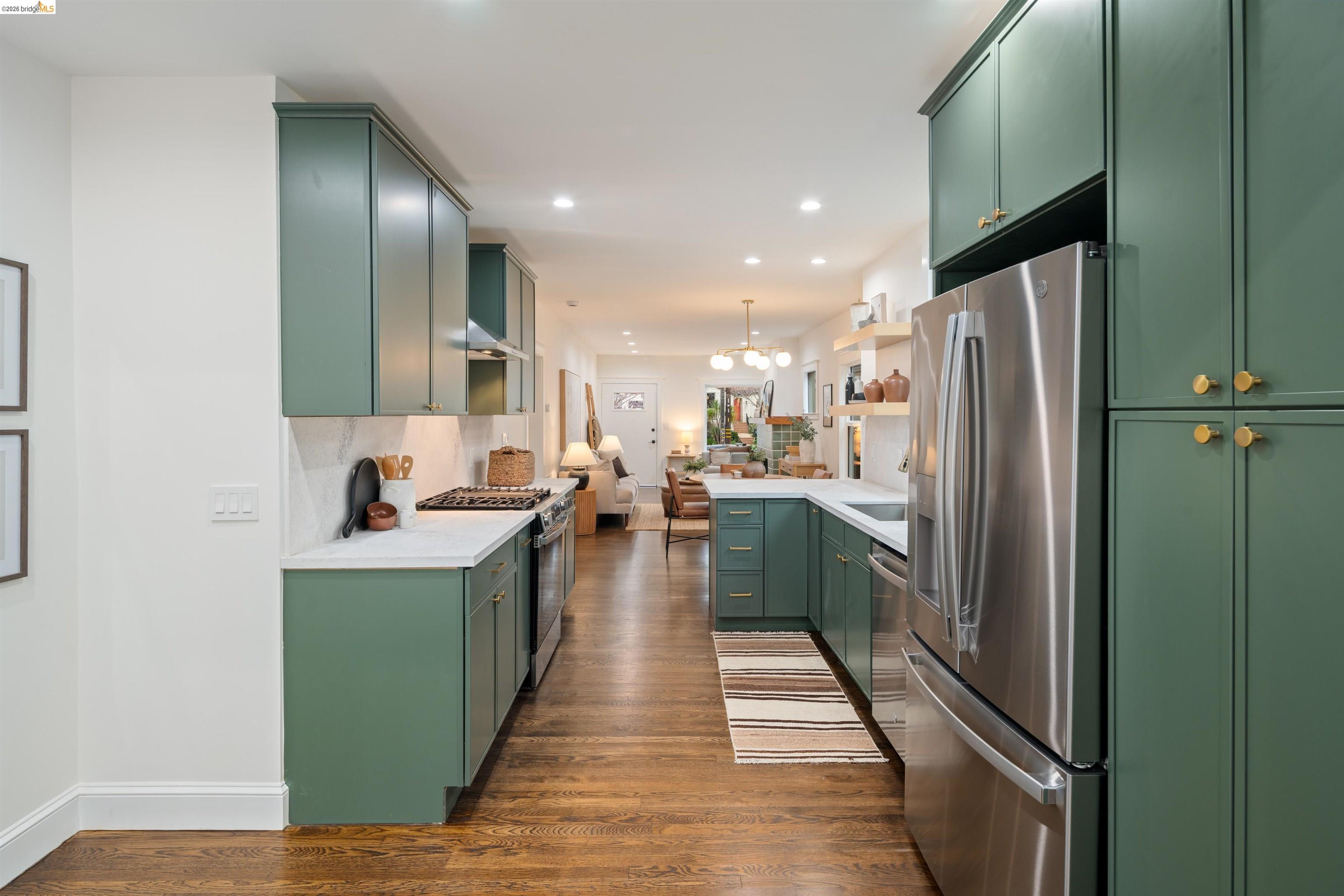 820 Key Rte Boulevard Albany, CA 94706 - Photo 13 of 48 a kitchen with kitchen island stainless steel appliances lots of counter top space and a sink
