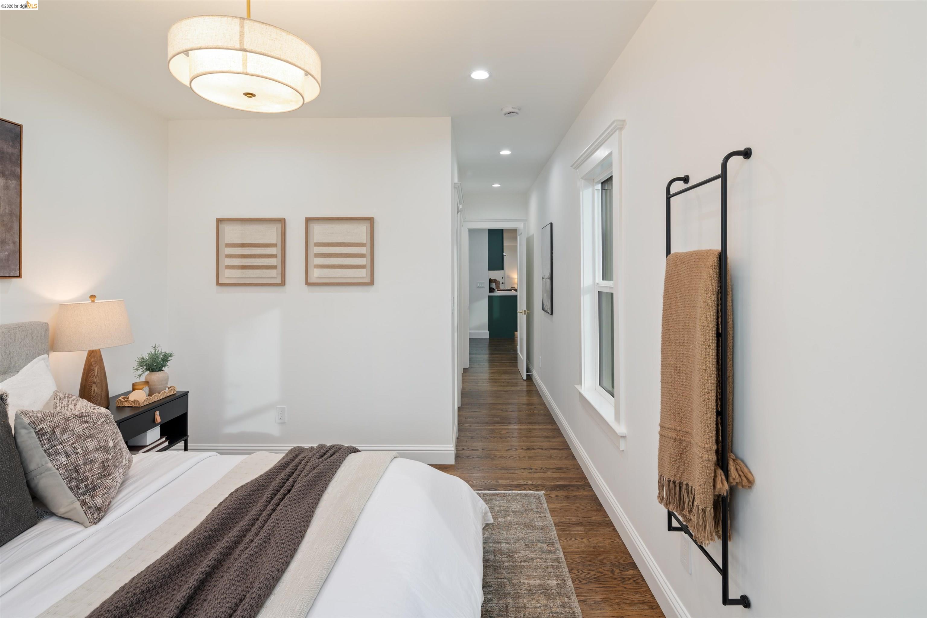 820 Key Rte Boulevard Albany, CA 94706 - Photo 20 of 48 a bedroom with bed and a chandelier