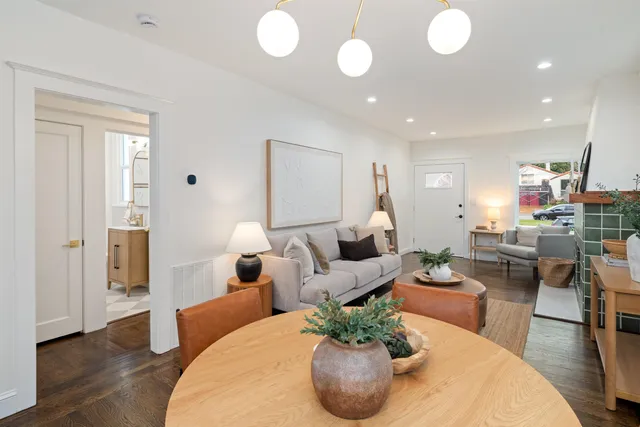 a view of a chairs and table on the balcony