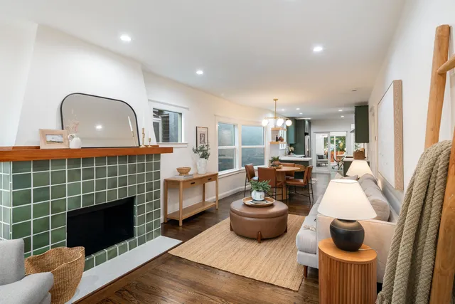 a living room with furniture and a chandelier