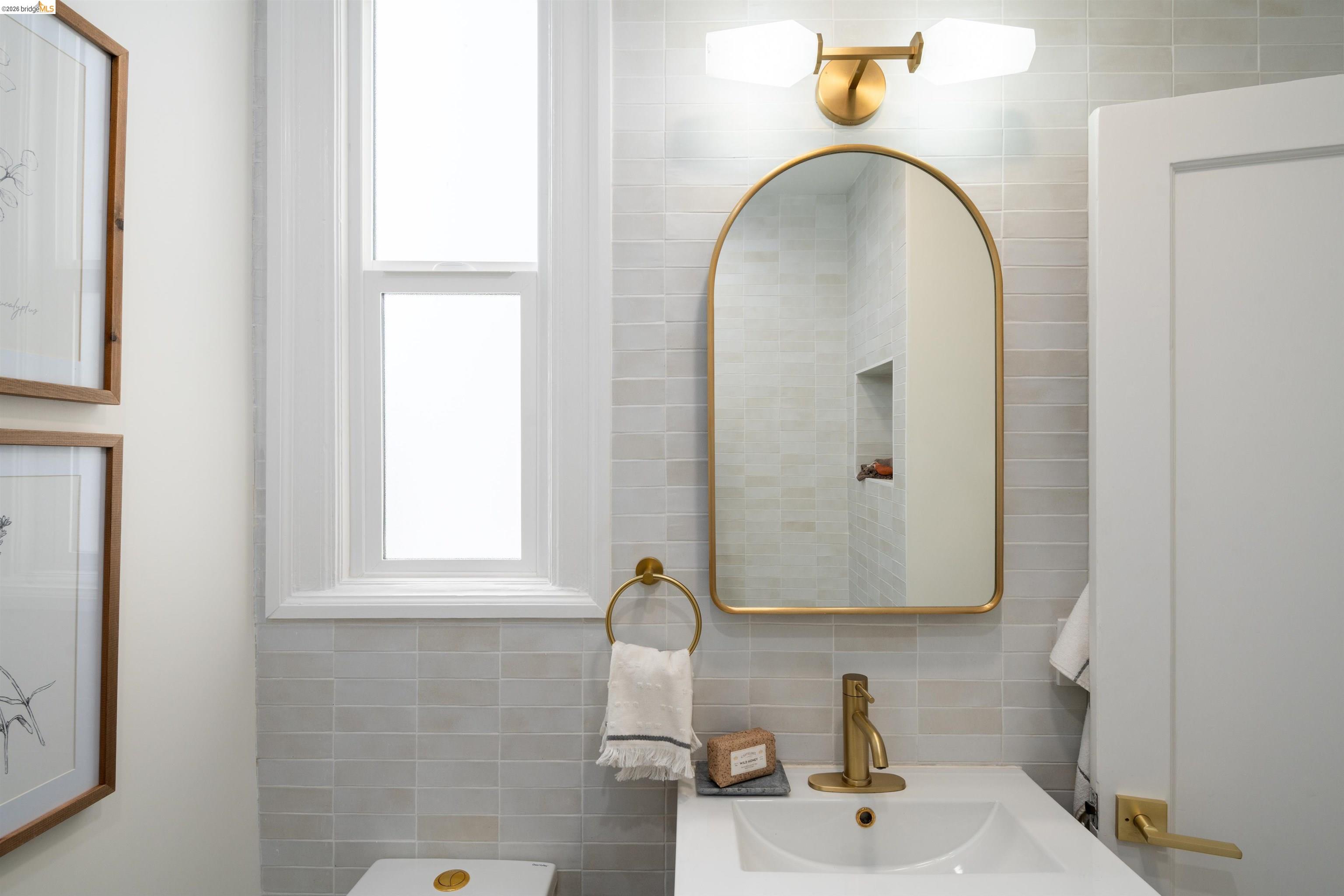 820 Key Rte Boulevard Albany, CA 94706 - Photo 34 of 48 a bathroom with a sink and a mirror