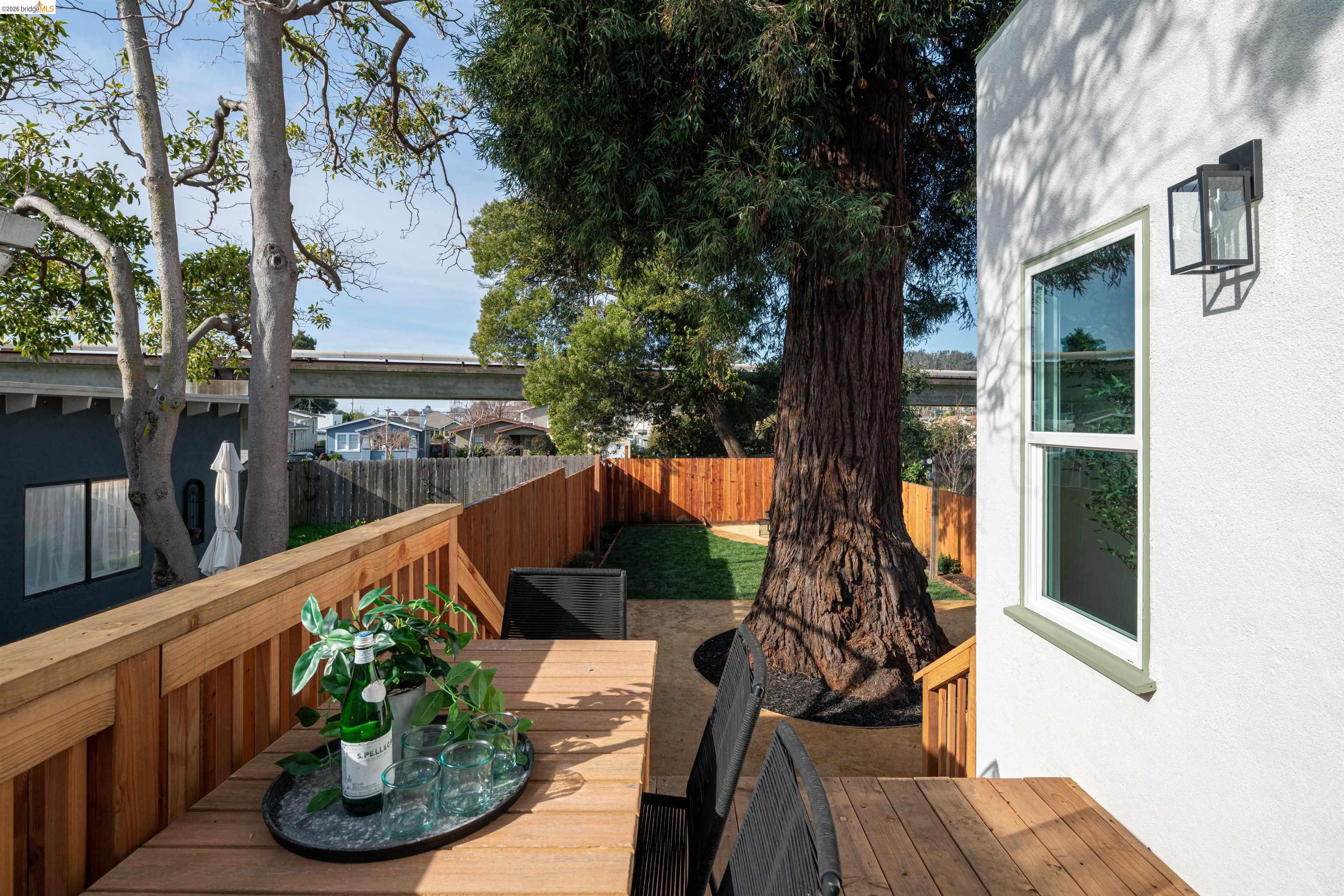 820 Key Rte Boulevard Albany, CA 94706 - Photo 39 of 48 a view of a balcony with potted plants and wooden fence