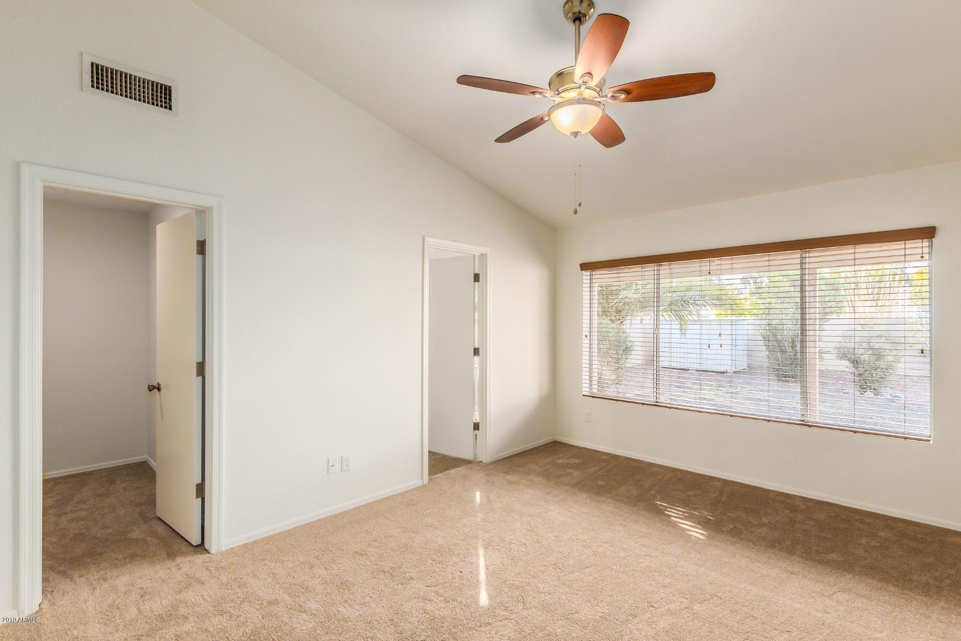 213 West Marco Polo Road Phoenix, AZ 85027 - Photo 13 of 21 a view of an empty room with a window
