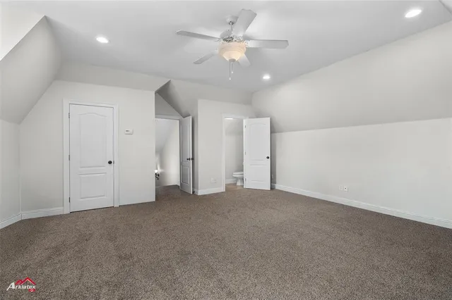 an empty room with fan and a ceiling fan