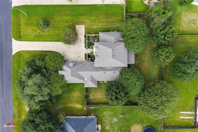 an aerial view of a house with a garden