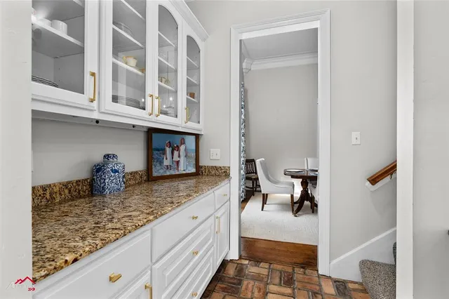 a view of living room with granite countertop furniture and fireplace