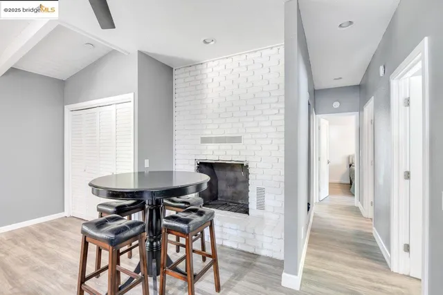 a view of a livingroom with furniture and a fireplace