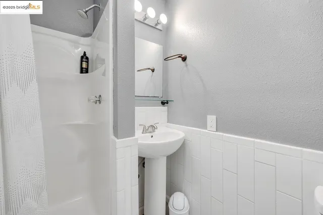 a bathroom with a sink and mirror