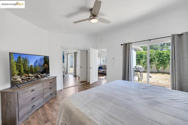 a bedroom with a large bed and a window