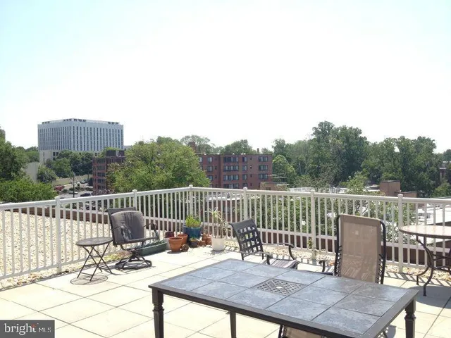 a view of a deck with a table and chairs
