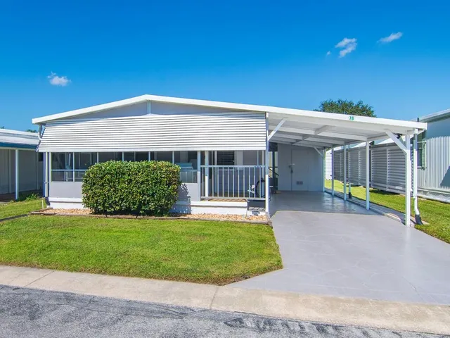 a view of an house with backyard porch and furniture
