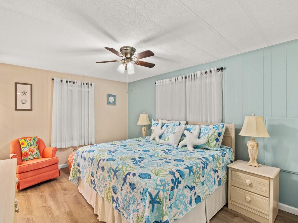 4800 Southeast Federal Highway, Unit 76 Stuart, FL 34997 - Photo 17 of 32 a bedroom with a bed and a couch