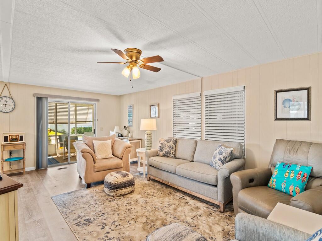 4800 Southeast Federal Highway, Unit 76 Stuart, FL 34997 - Photo 6 of 32 a living room with furniture and a window